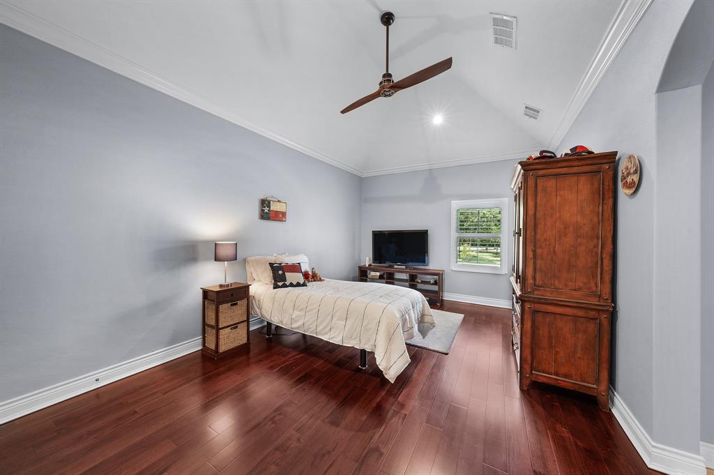 402 Cole Trail Sulphur Springs, TX 75482 - Photo 29 of 39 a bed room with furniture and a flat screen tv