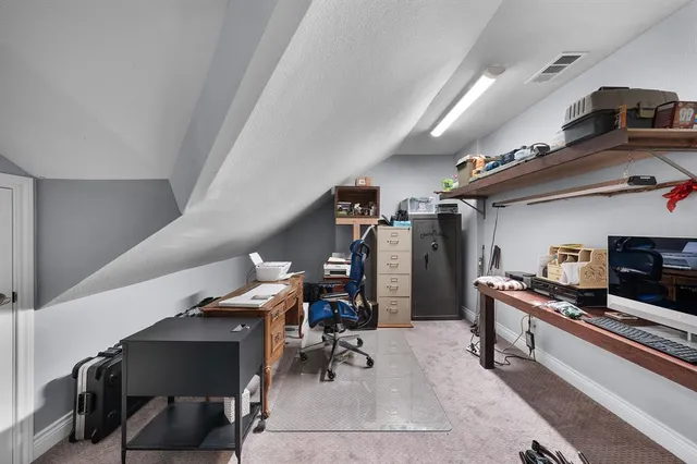 a living room with furniture large window and a table