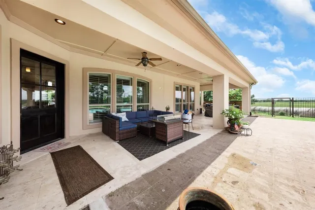 a view of house with outdoor space and swimming pool
