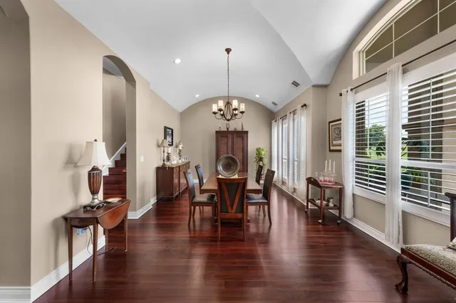 a living room with fireplace furniture and a wooden floor