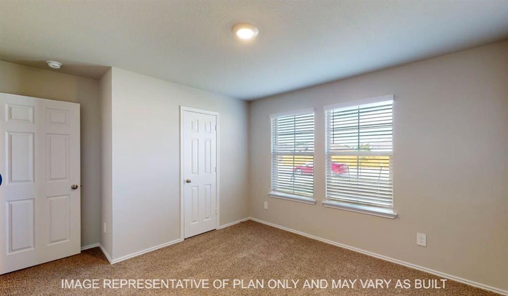 10204 Neptune Court Waco, TX 76708 - Photo 17 of 20 Carpeted room with neutral wall tones and white trim