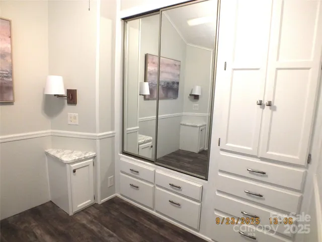 a bathroom with a shower and a sink