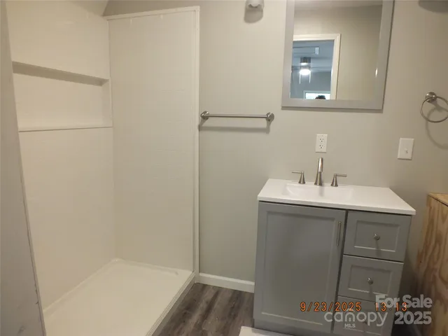 a bathroom with a sink and mirror