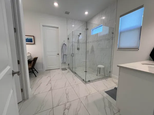 a bathroom with a shower and a toilet