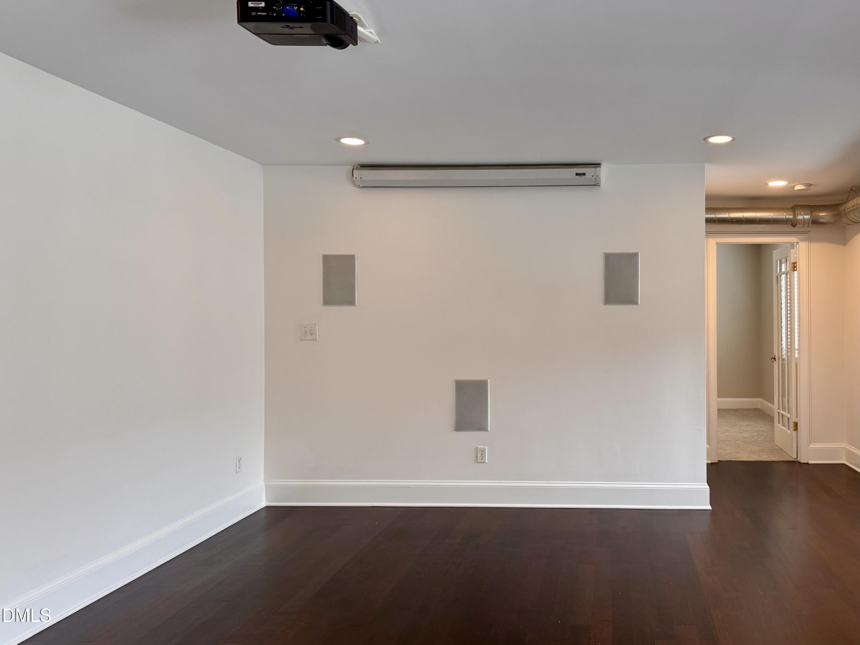 2204 Stafford Avenue, Unit 202 Raleigh, NC 27607 - Photo 6 of 15 a view of an empty room with wooden floor