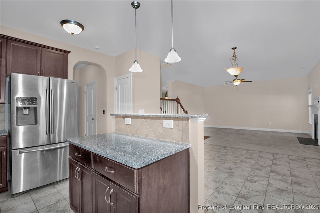 89 Revolutionary Road Cameron, NC 28326 - Photo 12 of 37 a kitchen with kitchen island a counter top space cabinets and stainless steel appliances