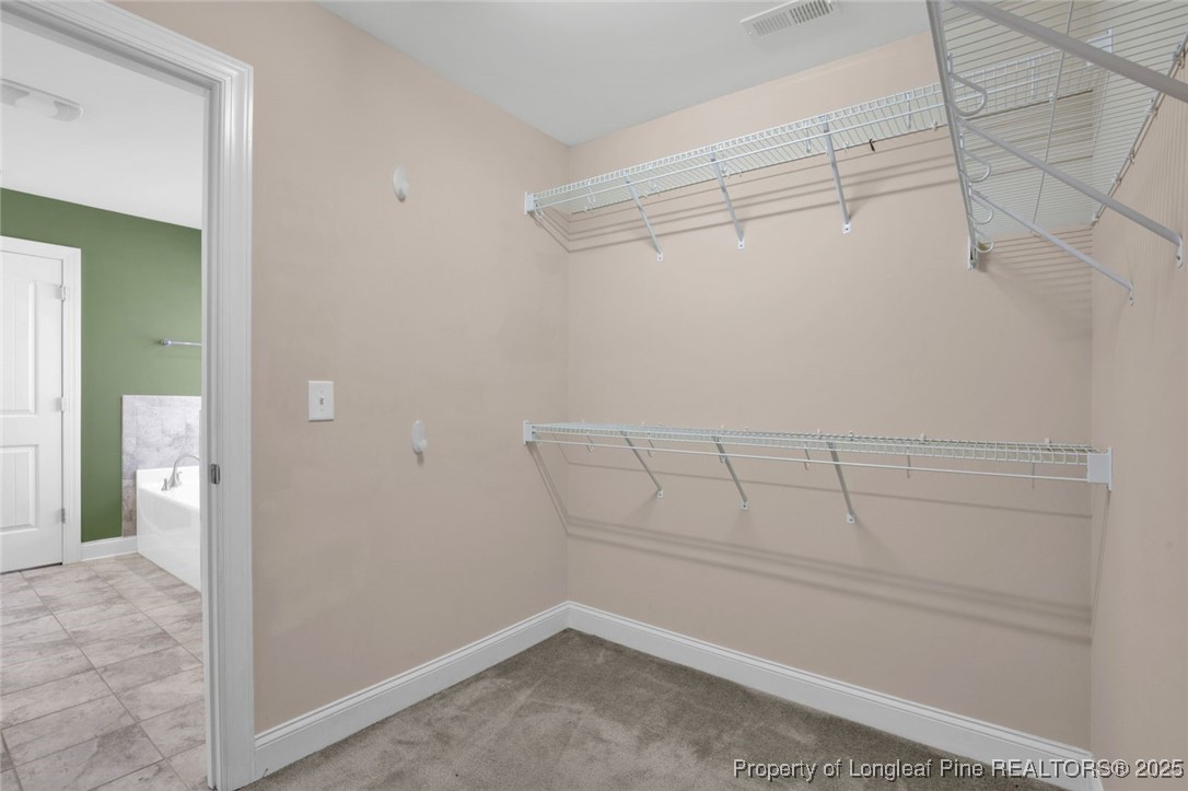 89 Revolutionary Road Cameron, NC 28326 - Photo 19 of 37 a view of a room with racks on the wall