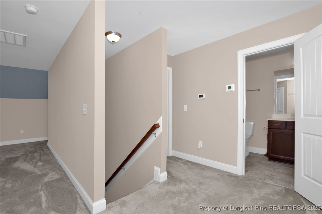 89 Revolutionary Road Cameron, NC 28326 - Photo 20 of 37 a view of a hallway with closet and wooden floor