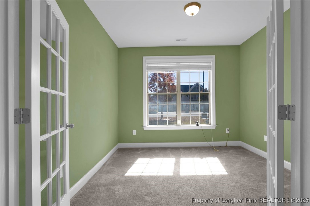 89 Revolutionary Road Cameron, NC 28326 - Photo 3 of 37 a view of an empty room with a window