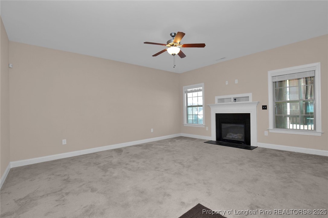89 Revolutionary Road Cameron, NC 28326 - Photo 6 of 37 a view of empty room with a fireplace