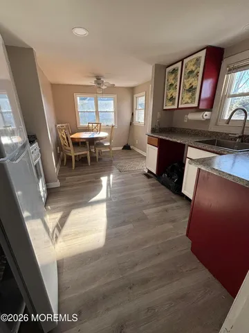 a living room with furniture and painting on the wall