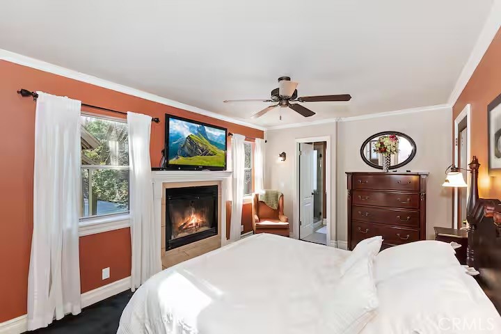 1055 Meadow Brook Road Lake Arrowhead, CA 92352 - Photo 11 of 27 a bedroom with a bed and a fireplace