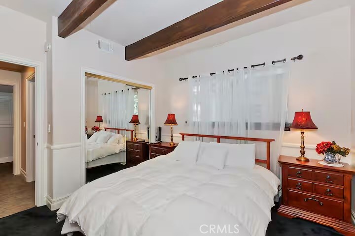 1055 Meadow Brook Road Lake Arrowhead, CA 92352 - Photo 12 of 27 a bed room with a bed and a closet