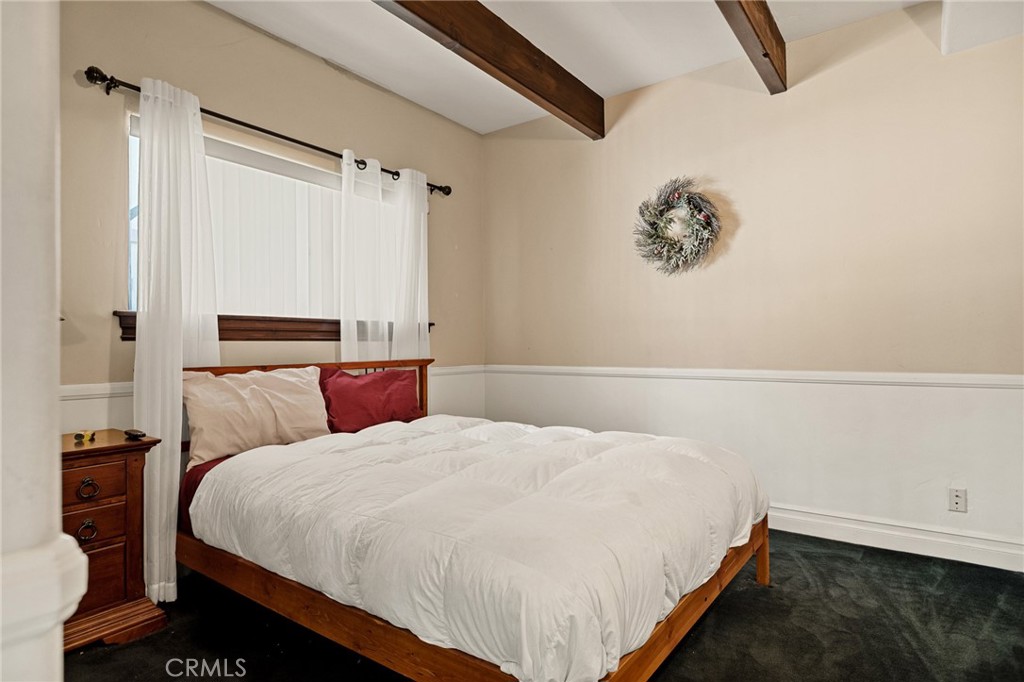 1055 Meadow Brook Road Lake Arrowhead, CA 92352 - Photo 14 of 27 a bedroom with a bed and a window