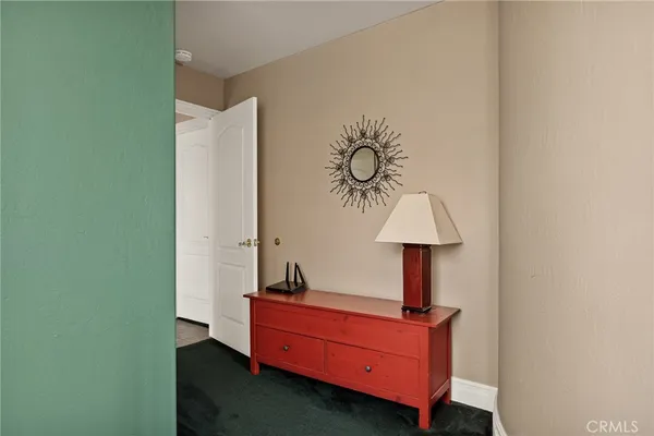 a room with table and a mirror