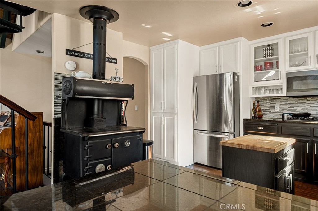 1055 Meadow Brook Road Lake Arrowhead, CA 92352 - Photo 3 of 27 a kitchen with stainless steel appliances a refrigerator and a stove