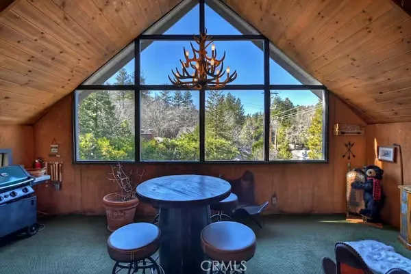 a view of a room with furniture and a window