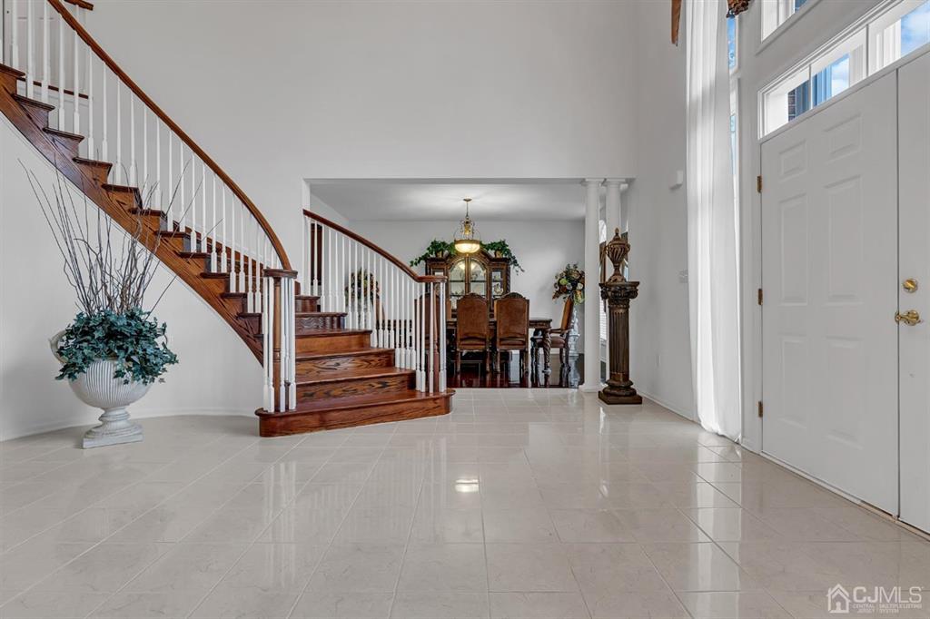 8 Risa Benjamin Way Freehold, NJ 07728 - Photo 13 of 63 Foyer with tile floor with staircase leads to seco