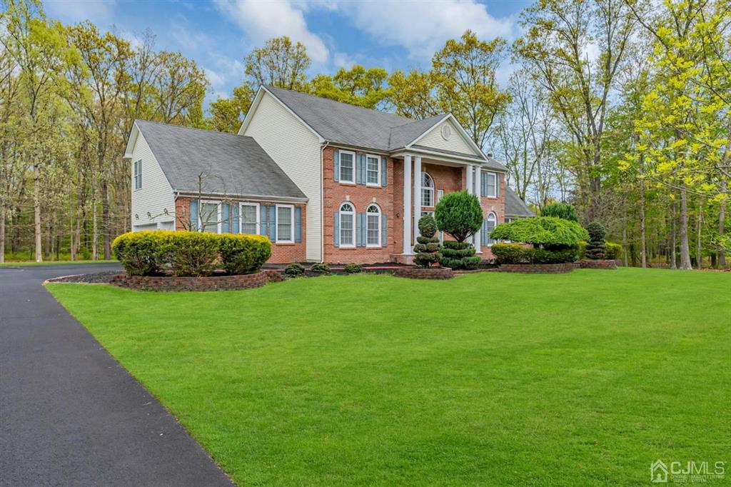 8 Risa Benjamin Way Freehold, NJ 07728 - Photo 4 of 63 a front view of a house with a yard