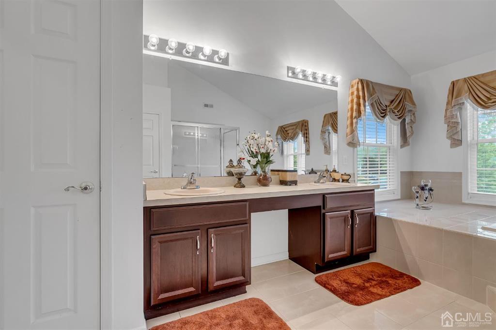 8 Risa Benjamin Way Freehold, NJ 07728 - Photo 43 of 63 a spacious bathroom with a sink double vanity and a mirror