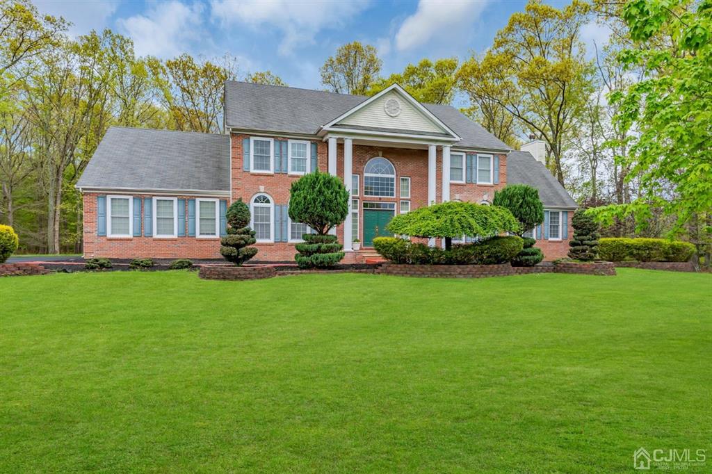 8 Risa Benjamin Way Freehold, NJ 07728 - Photo 5 of 63 a front view of a house with a garden