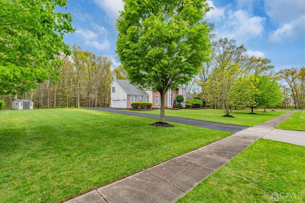 8 Risa Benjamin Way Freehold, NJ 07728 - Photo 54 of 63 a view of a house with a yard