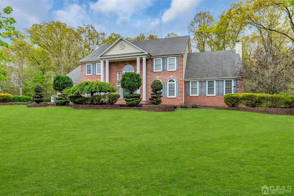 8 Risa Benjamin Way Freehold, NJ 07728 - Photo 6 of 63 a front view of a house with a yard and trees