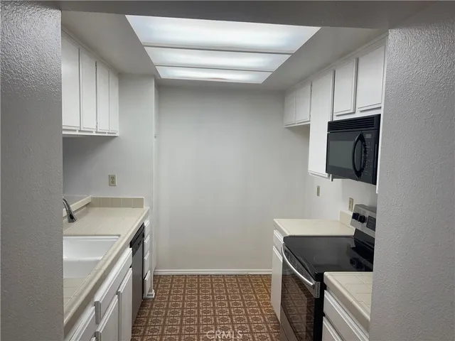 a kitchen with a stove and a microwave