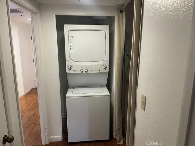 a bathroom with a granite countertop tub sink and mirror