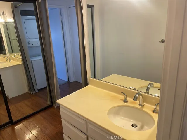 a bathroom with a glass shower door