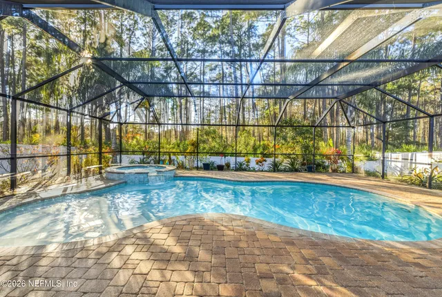 a view of a swimming pool with an outdoor space and seating area
