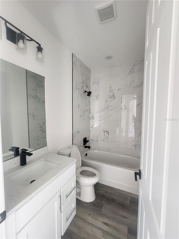 9483 Southwest 121st Terrace Dunnellon, FL 34432 - Photo 24 of 42 a bathroom with a sink a toilet and shower