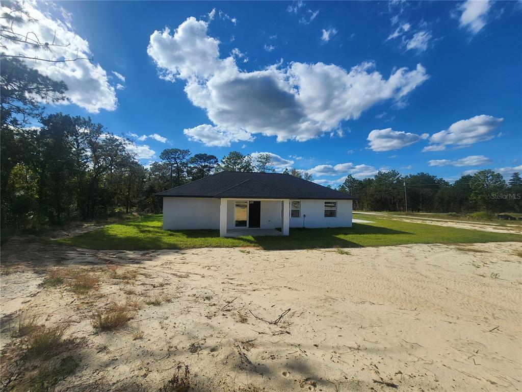 9483 Southwest 121st Terrace Dunnellon, FL 34432 - Photo 37 of 42 a view of a house with a yard