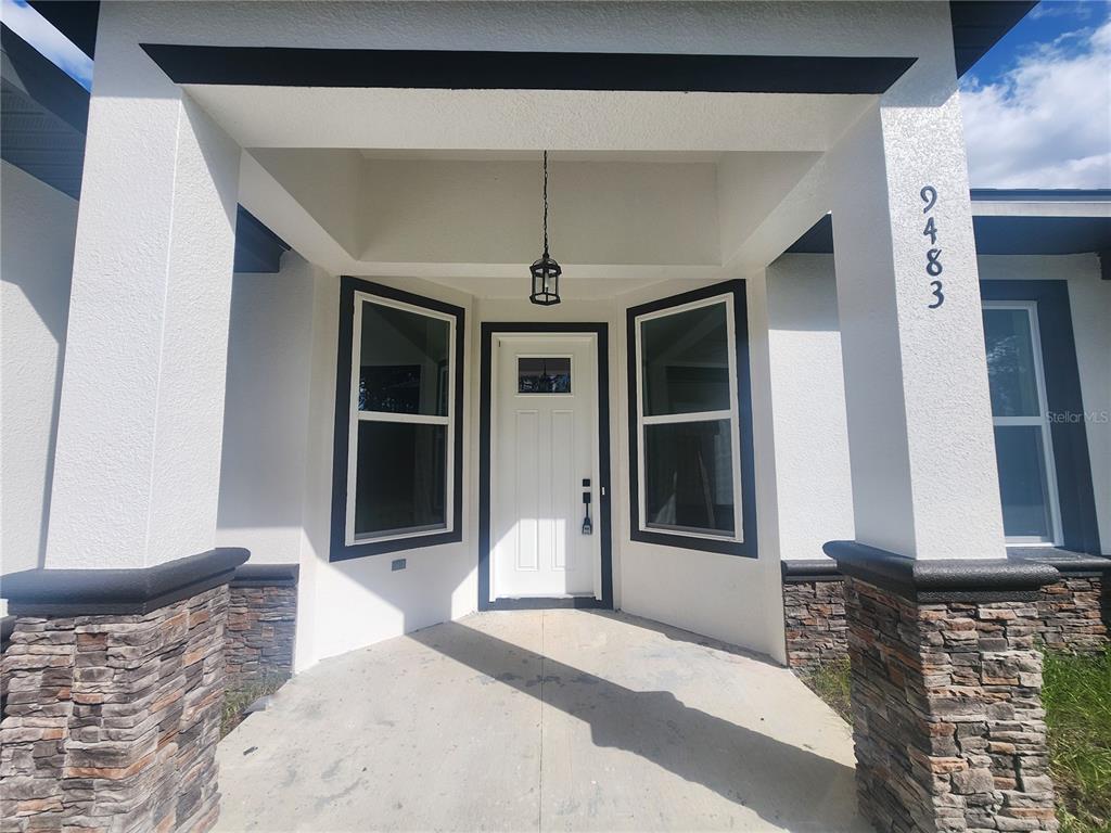 9483 Southwest 121st Terrace Dunnellon, FL 34432 - Photo 6 of 42 a bedroom with a bed and a window