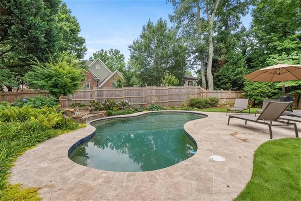 a view of a swimming pool with a outdoor seating