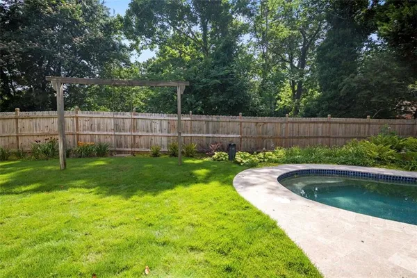 a view of a backyard with a tub