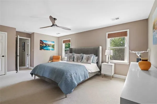 a bedroom with a bed furniture and window