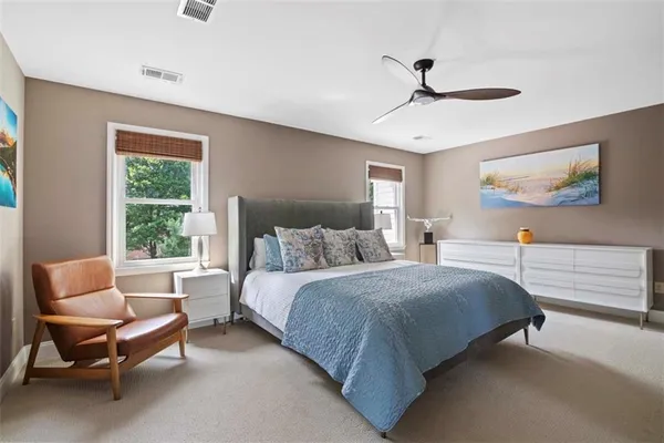 a bedroom with a bed and a couch