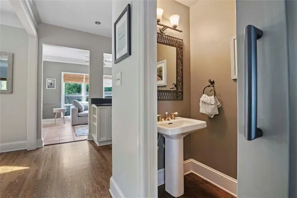 a view of living room with furniture and wooden floor