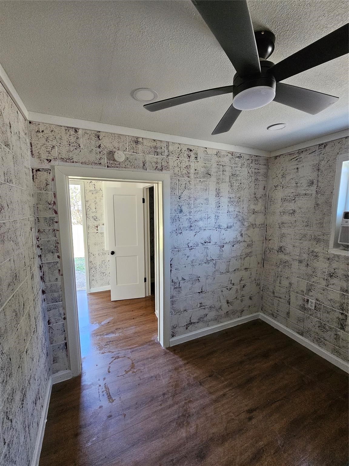 1305 Stowell Street Anahuac, TX 77514 - Photo 6 of 8 wooden floor in an empty room