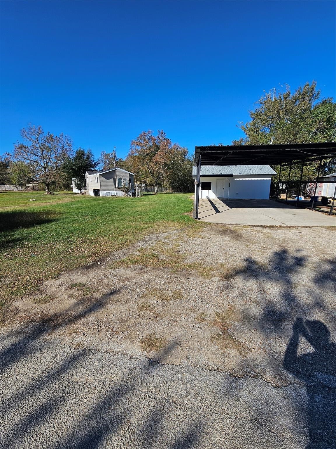 1305 Stowell Street Anahuac, TX 77514 - Photo 8 of 8 a view of a yard with an outdoor space