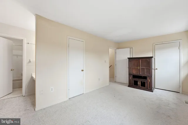 a view of empty room with a fireplace