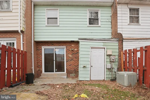 a view of a house with backyard of the house