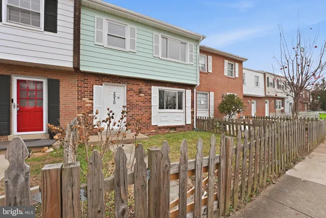 a front view of house with street