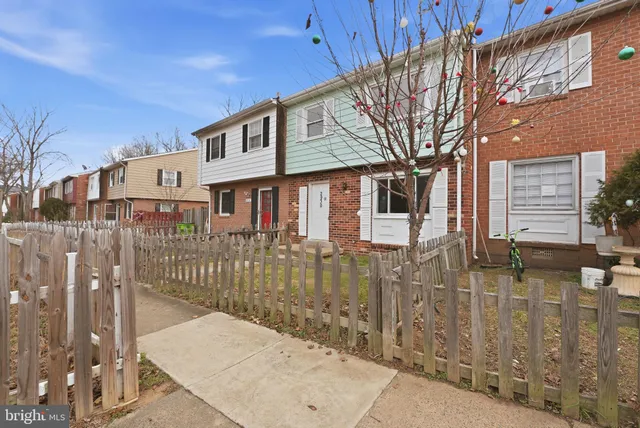 a front view of a house with a glass windows