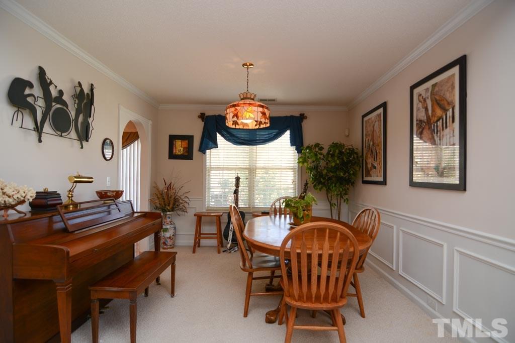 4601 Drewbridge Way Raleigh, NC 27604 - Photo 16 of 25 a dining room with furniture and window