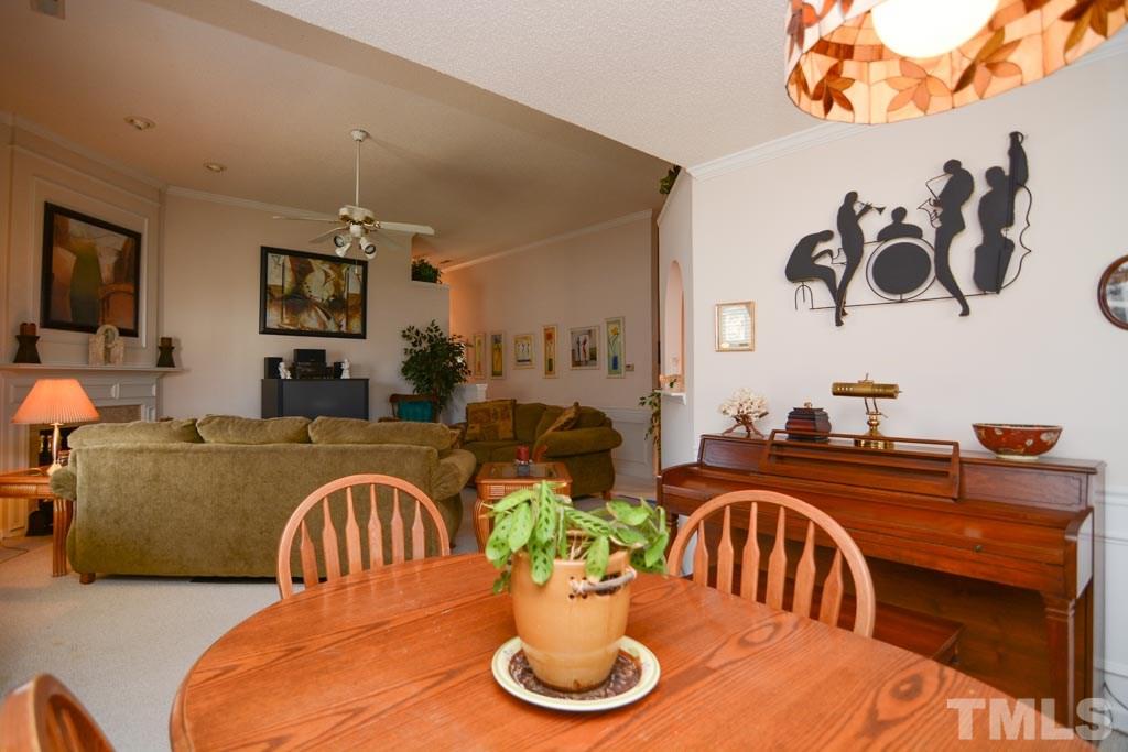 4601 Drewbridge Way Raleigh, NC 27604 - Photo 17 of 25 a view of a dining room with furniture