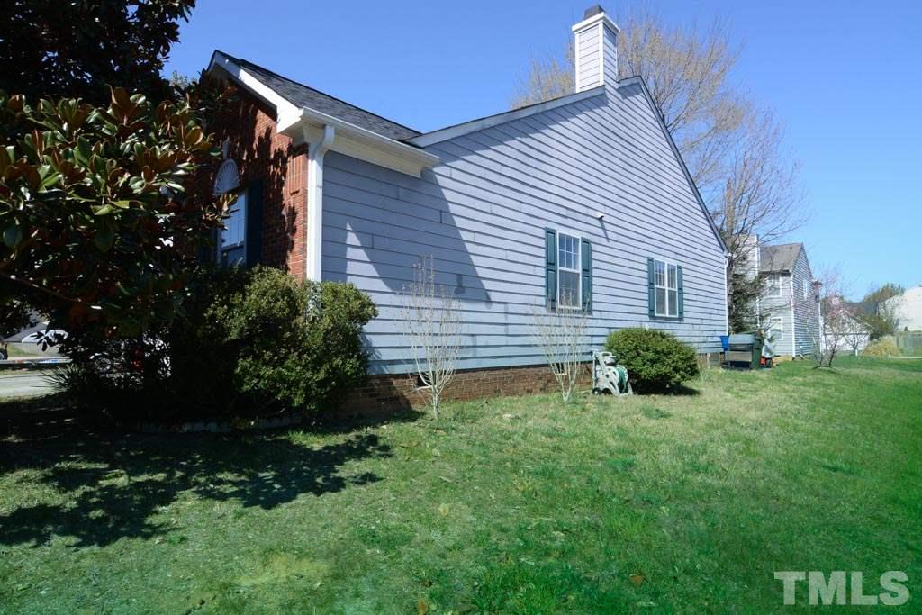 4601 Drewbridge Way Raleigh, NC 27604 - Photo 23 of 25 a front view of a house with a yard