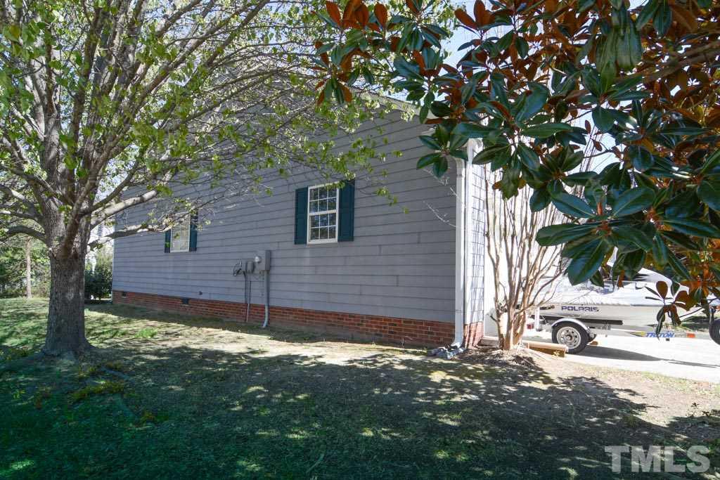 4601 Drewbridge Way Raleigh, NC 27604 - Photo 6 of 25 a view of a house with a tree