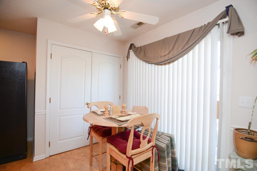 4601 Drewbridge Way Raleigh, NC 27604 - Photo 7 of 25 a dinning room with a table and chairs